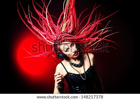 Expressive girl rock singer with great red dreadlocks.