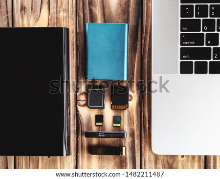 external hardisk, sd card and ssd card on table