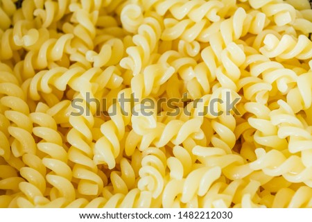 Boiled Fusilli Pasta Cooking Close up for Texture Background