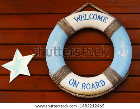  A life preserver that says "Welcome on board." Background.         