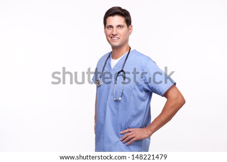 Young male nurse posing with hands on hips 