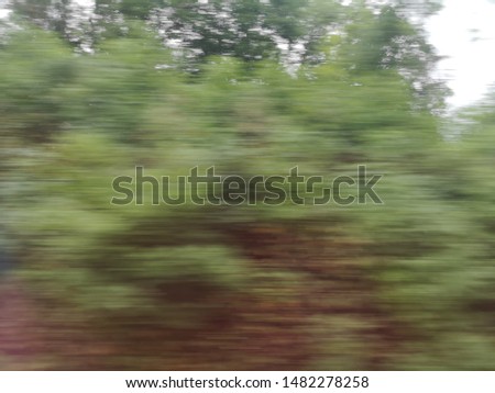 Green (Nature) fast motion blur background , green abstract background for nature concepts, movement from DB ICE Train in Europe. 