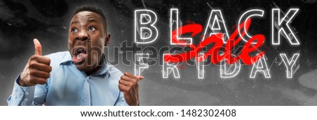 Black friday, sales concept. Neon lighted letters on gradient background. Astonished man screaming. Negative space. Modern design. Contemporary art. Creative conceptual and colorful collage.