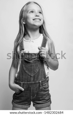 Children's fashion. Beautiful teenager girl. Black and white photo.