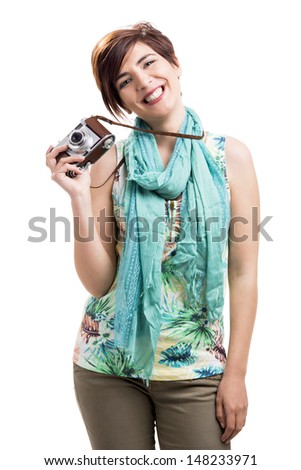 Beautiful and happy woman with a vintage camera, isolated over white background