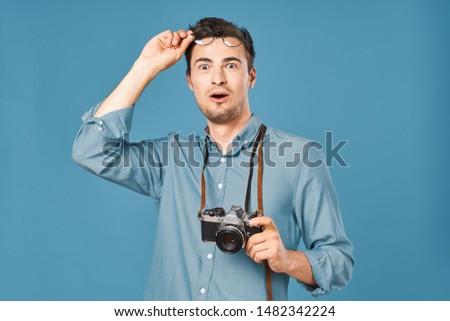 New technology camera young man blue shirt handsome face