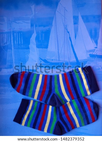 Composition with children's striped, colorful socks.