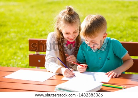 Kids drawing on white paper
