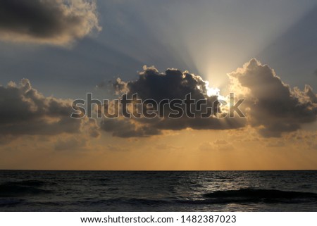 The sun sets over the horizon in the Mediterranean Sea in northern Israel