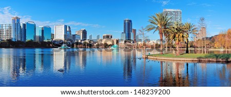 Orlando Lake Eola in the morning with urban skyscrapers and clear blue sky. Royalty-Free Stock Photo #148239200