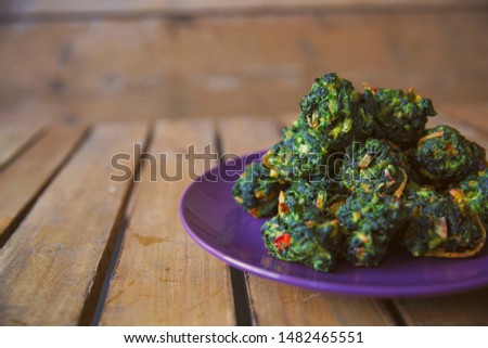 Saag Bora. Spinach pakora, ideal photo for Indian restaurant or takeaway website.
