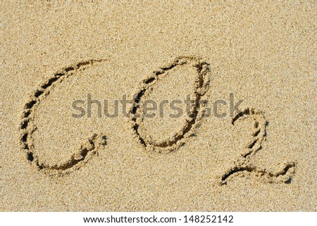 Concept or conceptual hand made or handwritten text in sand on a beach in an exotic island as metaphor to summer,ocean,sea,travel,vacation,tourism,tropical,coast,message,resort,paradise,sunny or water