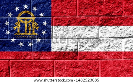 Flag State of Georgia close up painted on a cracked wall