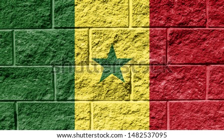 Flag of Senegal close up painted on a cracked wall
