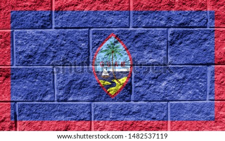 Flag of Guam close up painted on a cracked wall