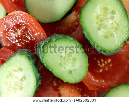 Red tomato and green cucumber. Fresh vegetable, great design for any purposes. Organic food