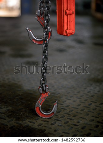 Steel hook and chain. Chain Hoist. Industrial hook hanging on reel chain