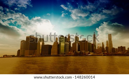 Panoramic view of Lower Manhattan skyline from Brooklyn Bridge Park on a sunny day - New York City.