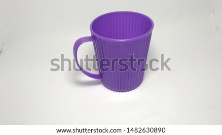 one cup made of insulated purple plastic with a white background - image