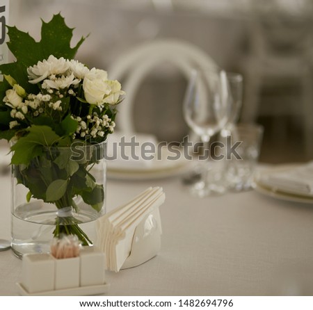 Decor from fresh flowers. Decor from color with glass elements.