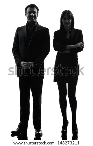 one caucasian couple business woman man in silhouette studio isolated on white background