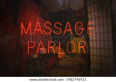Vintage Neon Massage Parlor Sign Royalty-Free Stock Photo #1482746921