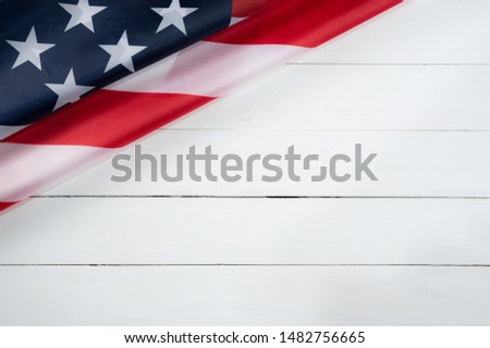 Top view of American flag on white wooden background. Happy Labor Day. Memorial Day.