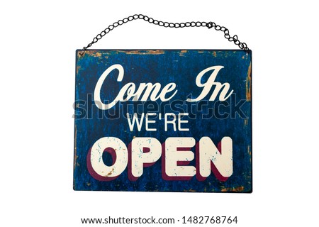 Open for business sign and welcome message in a store concept theme with grungy and worn metal sign with chains and the text ,come in we're open, isolated on white background with a clip path cut out