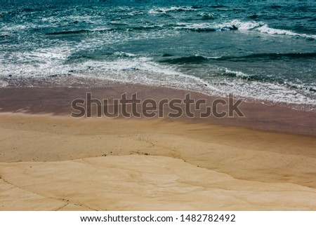 Scenic View Of Beach Against Clear Blue Sky