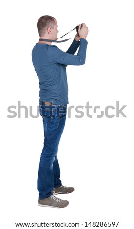 Back view of man photographing.  photographer in jeans. Rear view people collection.  backside view of person.  Isolated over white background.