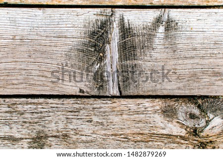 Natural old wood weathered board texture crack lines curves swirls close up background