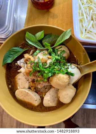 Spicy thai noodle soup with pork.