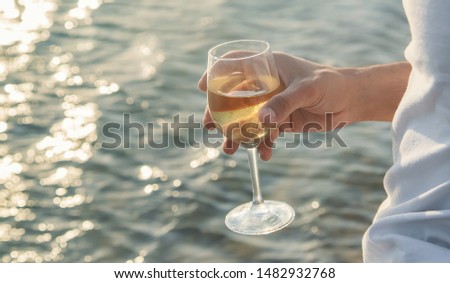Drink wine by the sea. Selective focus. nature