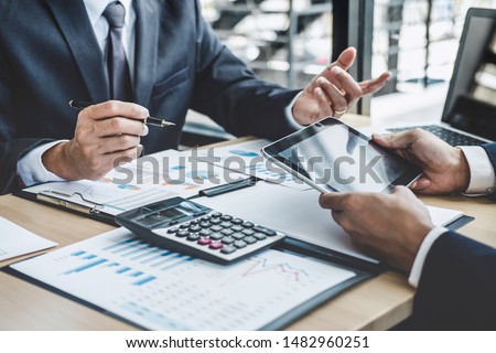 Finance manager meeting discussing company growth project success financial statistics, professional investor working start up project for strategy plan with document, laptop and digital tablet. Royalty-Free Stock Photo #1482960251