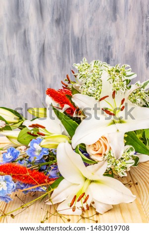 Bouquet of summer festive flowers. The concept of a romantic gift. Bridal bouquet. Light wooden abstract background