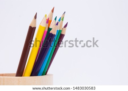colored pencils in the beaker, concept back to school
