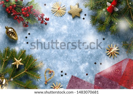 Christmas card with fir branches, red ribbons and decorations, wooden ornaments, confetti with snow. Christmas flat lay