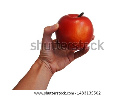young female hand holding one red Apple. Place for text