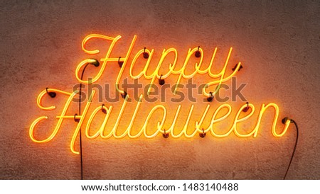 Neon sign that says the word Happy Halloween in bright yellow / orange colours, on a grunge  concrete wall background.