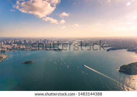 Aerial view of Sydney Central Business District and Harbour with yachts and ferries. Australia