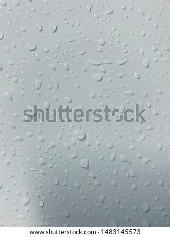 natural water drop on duck egg blue  colored  background 