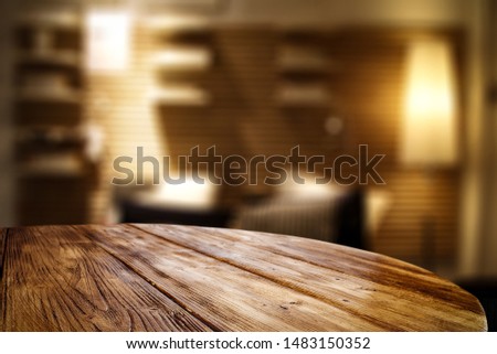 Brown wooden table and home interior blurred background. Free space for your decoration. 