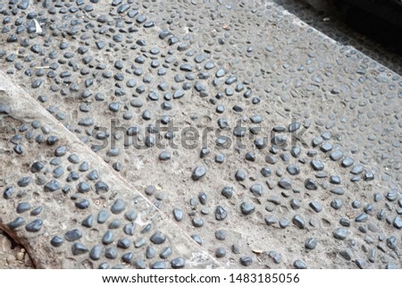 Side walk from small rock structure pattern background