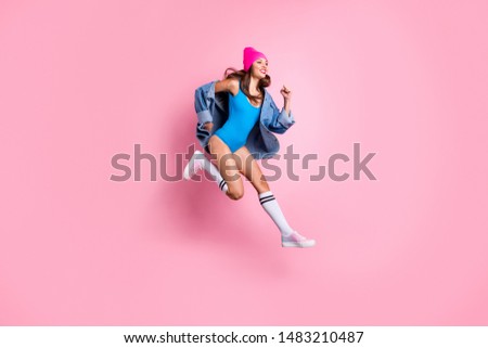 Full body photo of pretty lady running dreaming wearing blue bodysuit denim jeans jacket isolated over pink background