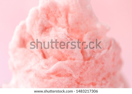 Tasty cotton candy on color background, closeup