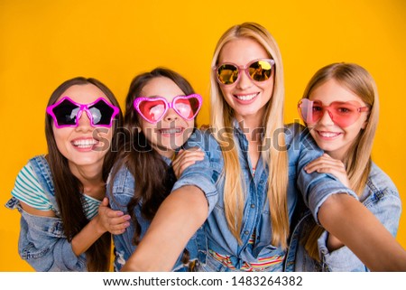 Close-up photo portrait of four nice beautiful carefree inspired positive nice glad with teeth smile moms and their offspring making picture isolated vivid background