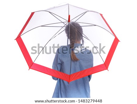 Portrait of teen girl holding umbrella - back view, isolated on white background. Happy child with umbrella for autumn rainy day. Caucasian young teenager in denim shirt - rear view.