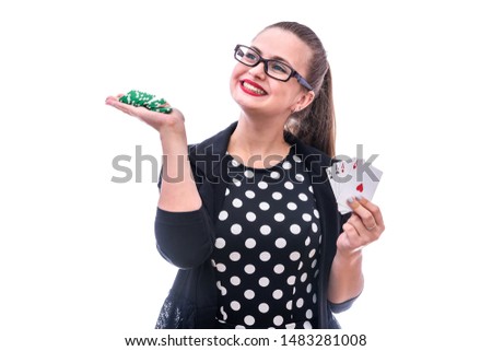 Young woman holding playing cards and chips isolated on white