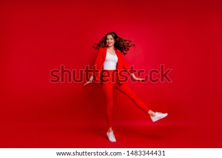 Full size photo of stunning lady turning around having lips stick isolated over red background