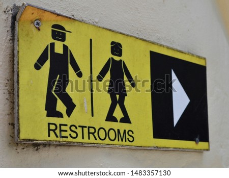 Toilet icons set. Men and women WC signs for restroom. Restroom sign on a toilet wall.
